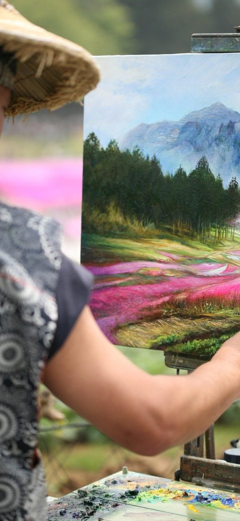 改图宝调色面板截图，屏幕中央是一张偏暖的人像照片，下方六个滑杆依次排列，当前色温滑杆被手指按住